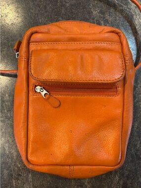 Compact Orange Leather Crossbody Bag with Front Pocket